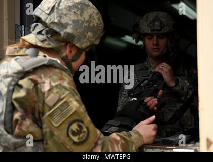 Tech. Sgt. Christopher Shapland, a response force leader with the 387th Expeditionary Security Forces Squadron, issues an M-16 weapon from the armory during a force protection condition delta exercise at an undisclosed location in Southwest Asia, April 27, 2017. The 387th Air Expeditionary Group conducted a force protection condition delta exercise to demonstrate base defense capabilities in response to increased terrorist threat levels. Stock Photo