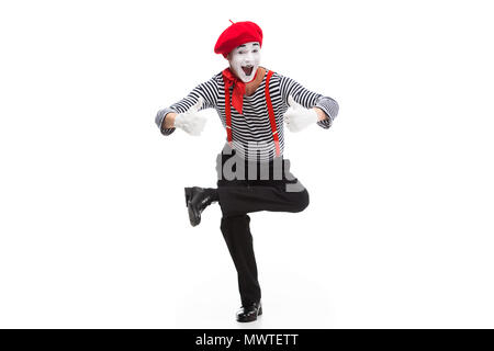 funny mime performing on one leg and showing thumbs up isolated on white Stock Photo