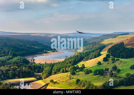 Upper Derwent Valley with two Lancaster bombers passing the Derwent Dam in the style of 617 Squadron Dambusters, Peak District, England, UK Stock Photo