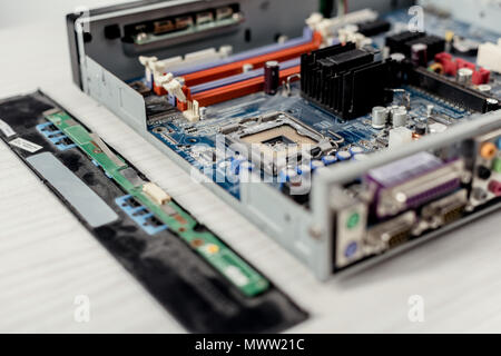 close up of computer motherboard and details on table Stock Photo