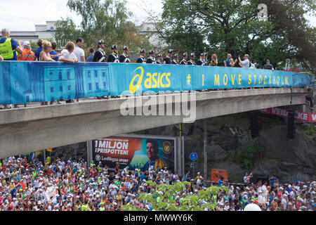 ASICS Stockholm (STHLM) Marathon 2018. Wide view of The musketeers of the Royal Life guards Infantry of Sweden, on the bridge, waiting for the signal to fire blank shots and mark the start of the race, for the thousands of runners waiting under the bridge. Stockholm, Sweden. 2nd June 2018. Credit: BasilT/Alamy Live News Stock Photo