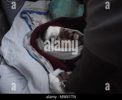 Srinagar, Kashmir, India. 2nd June, 2018. Kashmiri youth namely Qaisar Amin Bhat, 21, who sustained injuries in Srinagar on Friday after being run over by a police vehicle died on Saturday, June 2, 2018. Many mourners sustained injuries as Indian forces resorted to massive teargas shelling and chili gas firing on mourners of Qaisar Amin Bhat, Amidst heavy clashes people shouldered his body to Martyr's graveyard where he was laid to rest in Indian-Administered-Kashmir on june 2, 2018. Credit: Sanna Irshad Mattoo/ZUMA Wire/Alamy Live News Stock Photo