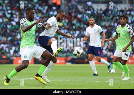 Wembley Stadium, London, UK. 2nd June, 2018. International football friendly, England versus Nigeria; John Ogu of Nigeria competes with Raheem Sterling of England for the ball Credit: Action Plus Sports/Alamy Live News Stock Photo