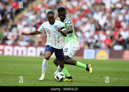 Wembley Stadium, London, UK. 2nd Jun, 2018. Raheem Sterling of England and John Ogu of Nigeria in action  .Football International friendly, England v Nigeria at Wembley Stadium in London on Saturday 2nd June 2018.  this image may only be used for Editorial purposes. Editorial use only, license required for commercial use. No use in betting, games or a single club/league/player publications. pic by Andrew Orchard//Andrew Orchard sports photography/Alamy Live news Stock Photo