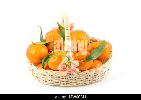 Bunch of fresh tangerines oranges on basket, Fresh orange in rattan baskets gift for Chinese New Year in concept isolated white background. Stock Photo