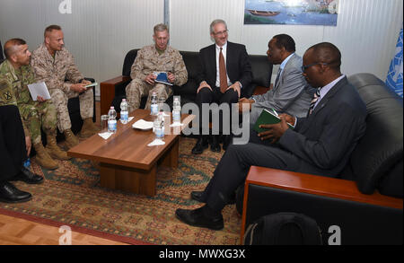 U.S. Africa Command commander U.S. Marine Corps Gen. Thomas D. Waldhauser, and the U.S. Ambassador to Somalia Stephen Schwartz, center, meet with the Special Representative of the Chairperson of the African Union Commission for Somalia Ambassador Francisco Caetano Jose Madeira at Mogadishu International Airport, Somalia, April 29, 2017. Waldhauser has stated that the U.S. and its African partners should bring forward creative and viable solutions to meet the complicated and diverse challenges facing the African continent. Stock Photo