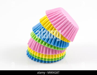 Colorful cupcake, paper cups, muffin cup isolated on white background, Stack of paper cupcakes, muffins on white background. Stock Photo