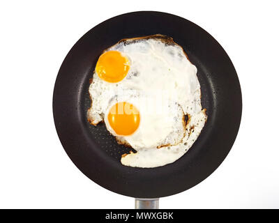 Traditional healthy easy breakfast meal with two fried eggs served on a frying pan, International simple food,Breakfast, Healthy food top view Stock Photo
