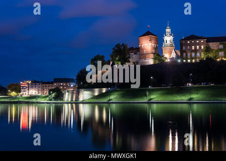 Wawel Castle, UNESCO World Heritage Site, across Vistula River, at night, Krakow, Poland, Europe Stock Photo