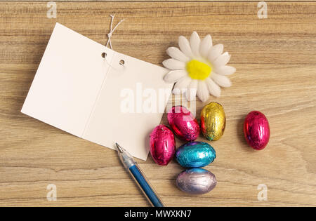 Easter concept. Happy Easter day with eggs, greeting card on wood table with Copy space. Stock Photo