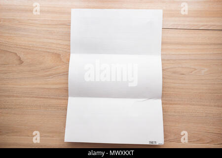 Top view,  White template paper and space for text on wooden background Stock Photo