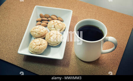 Almond Cookies And A Cup Of Coffee Stock Photo