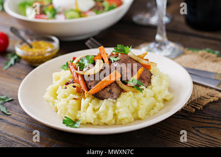 Fried chicken liver with vegetables and garnish of mashed potatoes. Healthy food Stock Photo