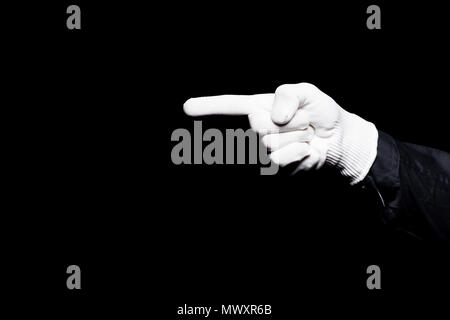 cropped image of mime pointing on something isolated on black Stock Photo
