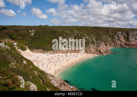 Beach at Pothcurno Bay / Cove in Cornwall, England, UK, showing the beach on a summer day. Aerial shot of holidaymakers sunbathing and swimming. Stock Photo