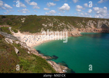 Beach at Pothcurno Bay / Cove in Cornwall, England, UK, showing the beach on a summer day. Aerial shot of holidaymakers sunbathing and swimming. Stock Photo