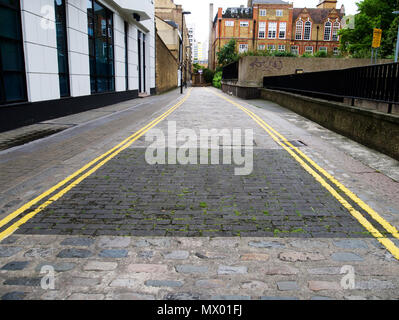 The last patch of wooden road surface in Chequer Street, London Stock Photo
