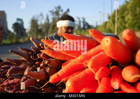 Egyptian Farmer Selling Carrots Beside The Road, Cairo, Egypt on 02-09-2006 Stock Photo