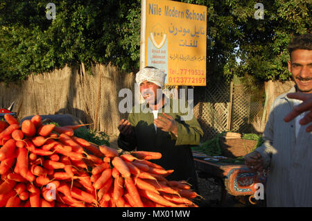 Egyptian Farmer Selling Carrots Beside The Road, Cairo, Egypt on 02-09-2006 Stock Photo