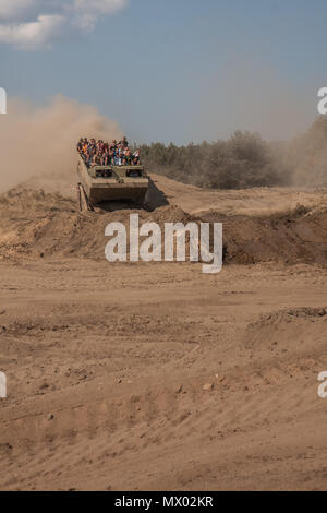 Borne Sulinowo, Poland - August 23, 2015: Military armoured vehicle takes tourists around the training ground Stock Photo