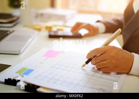 Certified public accountant, Man working on spreadsheet document financial data. Stock Photo