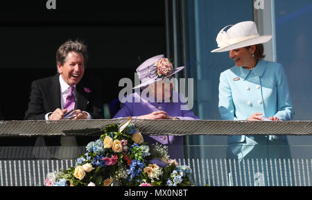 Queen Elizabeth II with racing manager John Warren (left)during derby day of the 2018 Investec Derby Festival at Epsom Downs Racecourse. Stock Photo