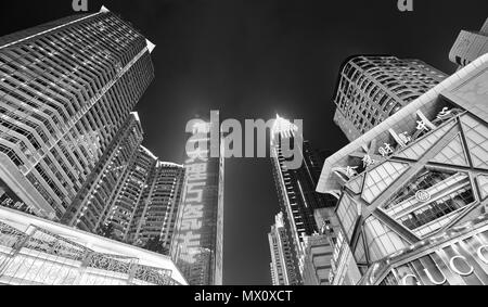 Chongqing, China - October 02, 2017: Looking up at modern buildings in downtown Chongqing at night. Stock Photo