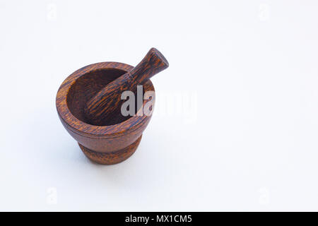 Wooden mortar on white background. Stock Photo