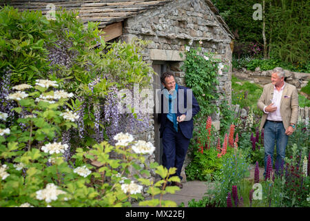 Gardening TV presenter and writer, Monty Don, is filmed by the BBC while looking at the BBC / RHS People's Choice Award - Show Garden Winner: Welcome  Stock Photo