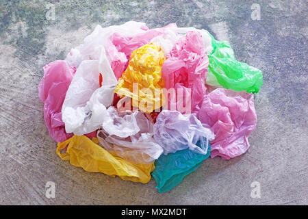 Colorful plastic bag on cement floor background. Stock Photo