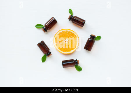 Bottle of essential oil from oranges citrus fruit on white background, Alternative medicine Stock Photo