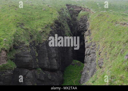 An opening in the hills on a hill walking path in gamrie. Stock Photo