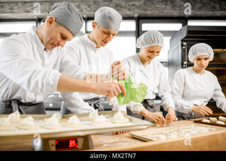 Bakers making buns at the manufacturing Stock Photo