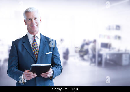Portrait of senior businessman using tablet in front of his modern office Stock Photo