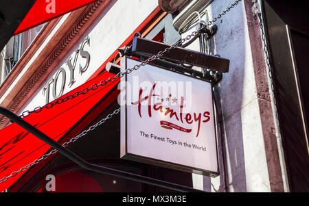 Name sign outside Hamleys, the iconic toy shop in Regent Street, London W1 a major shopping street in the capital city, UK Stock Photo