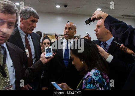 Senator Cory Booker (D-NJ) speaks with reporters in the U.S. Capitol subway after a closed senate briefing by Deputy Attorney General Rod Rosenstein.