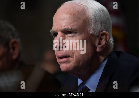 Senator John Mccain (R-AZ) asks Director of National Intelligence Dan Coats if President Trump asked him to bury evidence that the President has ties to Russia during a Senate Armed Services Committee hearing on world wide threats on Capitol Hill. Stock Photo
