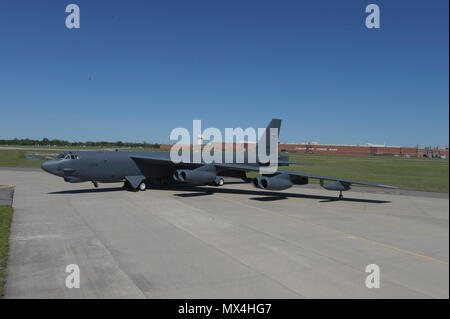 Boeing B-52H, 60-0005, poses in front of Oklahoma City Air Logistics Complex Bldg. 3001 following major overhaul on May 1, 2017, Tinker Air Force Base, Oklahoma. OC-ALC is responsible for depot level maintenance of the B-52 fleet with a large portion of the work taking place in the building shown behind. Stock Photo