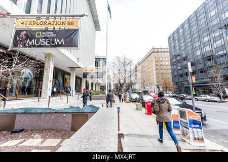 Washington DC, USA - March 9, 2018: National Geographic Museum sign, entrance with people walking by street and building Stock Photo