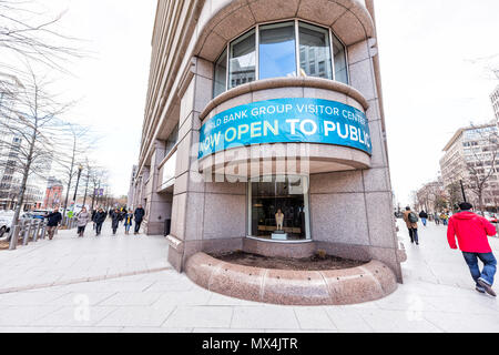 Washington DC, USA - March 9, 2018: World Bank Group Vistor Center with now open to public sign in winter, window, entrance to building, people pedest Stock Photo