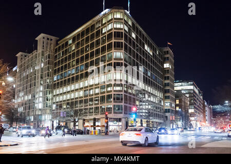 Washington DC, USA - December 28, 2017: Building in evening, holiday winter lights illuminated road street with traffic cars, intersection of 17th and Stock Photo