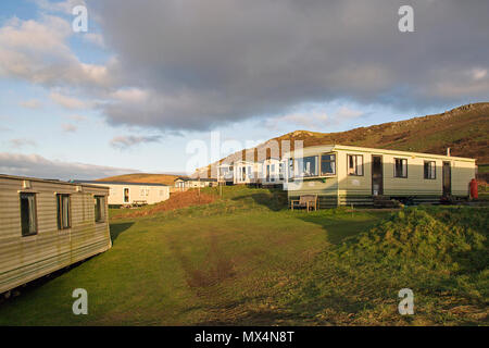 Gower, Wales, UK: December 15, 2017: Static caravan holiday homes at Hillend Caravan Park, Llangennith on the Gower Peninsular in winter. Stock Photo