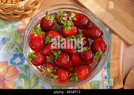 Fresh strawberry in capacity with water Stock Photo