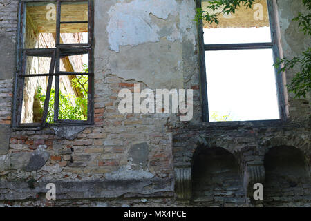 two old broken windows in castle Stock Photo