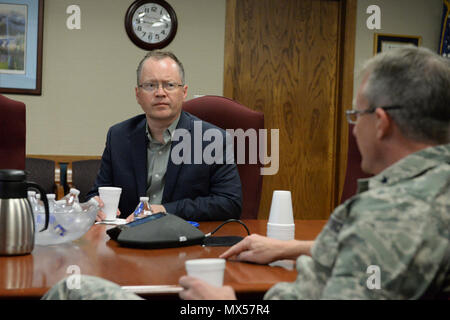 North Dakota Lt. Gov. Brent Sanford, left, listens to Brig. Gen. Robert Becklund, the North Dakota deputy adjutant general, as Becklund and 119th Wing command staff give an organizational briefing at the North Dakota Air National Guard Base, Fargo, N.D., May 2, 2017. Stock Photo