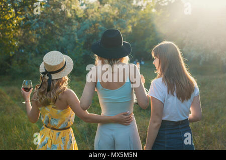 Group of girls friends making picnic outdoor. They have fun Stock Photo