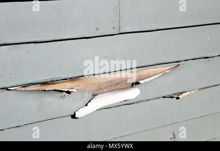 Wall showing the paint peeling on the siding Stock Photo