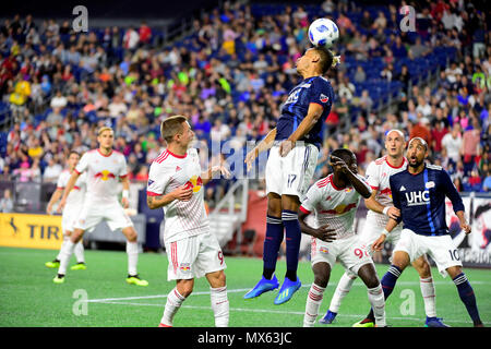 Foxborough Massachusetts, USA. 2nd June, 2018. New England Revolution forward Juan Agudelo (17) heads the ball during the MLS game between New York Red Bulls and the New England Revolution held at Gillette Stadium in Foxborough Massachusetts. The Revolution defeat the Red Bulls 2-1. Eric Canha/CSM/Alamy Live News Stock Photo