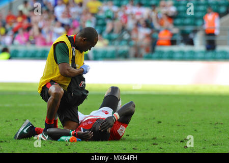 Twickenham Stadium, London, UK. 2nd Jun, 2018. Collins Injera (KEN) being treated on the field of play after a collison during the England V Kenya rugby sevens match at Twickenham Stadium, London, UK.  The match took place during the penultimate stage of the HSBC World Rugby Sevens Series. The series sees 20 international teams competing in rapid 14 minute matches (two halves of seven minutes) across 11 different cities around the world - the finale will be in Paris in June. Credit: Michael Preston/Alamy Live News Stock Photo