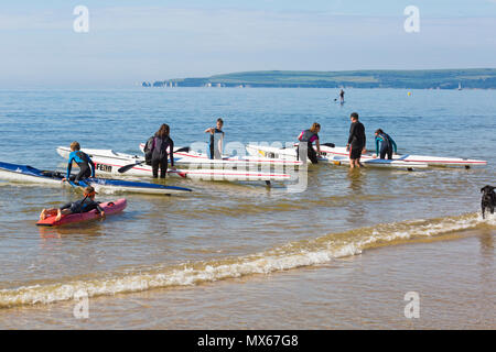 Branksome Chine, Poole, Dorset, UK. 3rd June 2018. UK weather: a lovely warm sunny start to the day, as visitors head to the seaside. People enjoying being on the sea in a surf skis and boards. Credit: Carolyn Jenkins/Alamy Live News Stock Photo